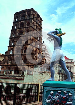 The thanjavur maratha palace tower with farmer statue