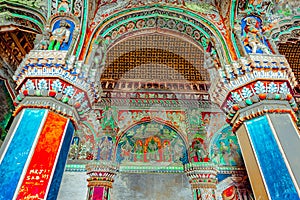 Thanjavur, Tamil Nadu, India - The high arches artworks and colorfully painted wall murals durbar hall Maratha Palace