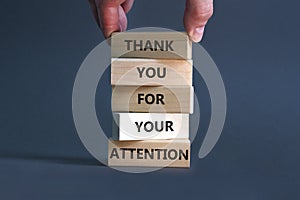 Thank you for attention symbol. Concept words Thank you for your attention on wooden blocks on a beautiful grey table grey