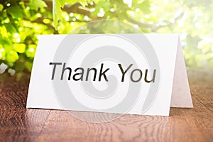 Thank You Card On Wooden Floor