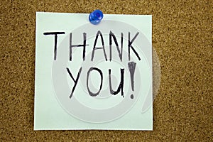 Thank you - colorful sticky notes with handwriting on cork bulletin board.