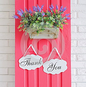 Thank you decoration boards hanging on pink door