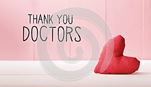 Thank You Doctors message with a red heart cushion