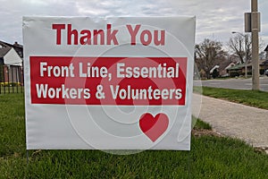 Thank you front line, essential workers & volunteers sign in front of a house during corona virus pandemic outbreak photo