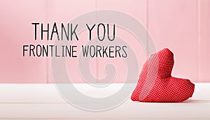 Thank You Frontline Workers message with a red heart cushion