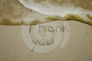 Thank you, gratitude concept, beautiful card, word written on sand beach