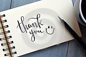 THANK YOU hand-lettered in notepad