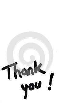 Thank you handwriting text close up isolated on white paper with copy space. Writing text on memo post reminder