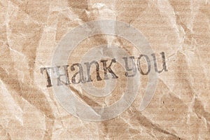 Thank you ink rubber stamp on crumpled paper