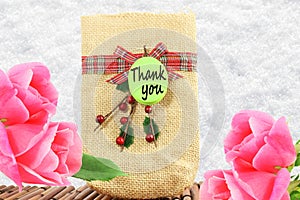 Thank you letter tag or label with flower and jute bag