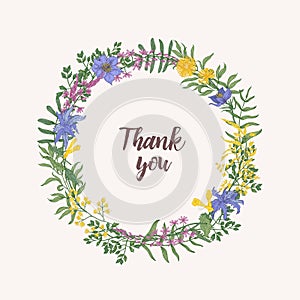 Thank You lettering written with cursive font inside round floral decorative frame or wreath consisted of wild blooming