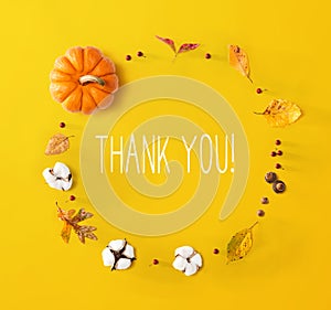 Thank you message with autumn leaves and orange pumpkin