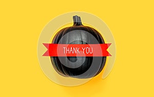 Thank you message with a black pumpkin