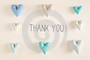 Thank You message with blue heart cushions