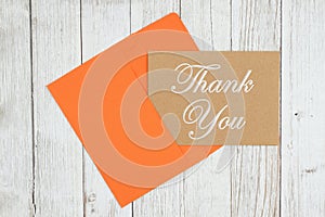 Thank you brown greeting card with envelope on textured weathered whitewash wood