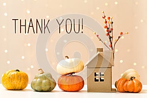 Thank you message with pumpkins with a house