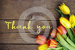 Thank You Message, Colorful tulips on wooden background. Spring flower background with blooming tulips,. Mother`s Day..