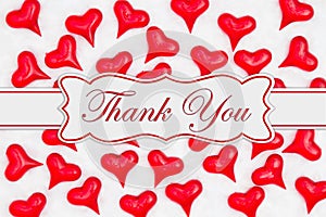 Thank you message with red hearts on white fabric