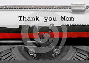 Thank you Mom phrase by the old typewriter on white paper