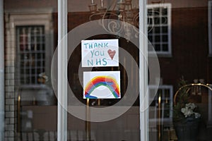 Thank you NHS clap for carers rainbow sign in window