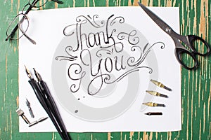 Thank you note calligraphy with writing equipment