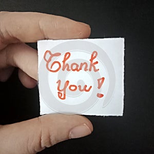 Thank you note, handwritten tiny mesage, handwriting paper note. photo