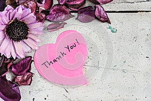 Thank you note in heart shape paper with pink flowers