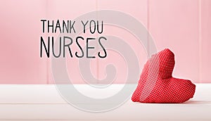 Thank You Nurses message with a red heart cushion