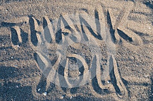 Thank you in sand