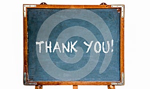 Thank you! text message in white chalk letters written on a school blue old grungy vintage wooden chalkboard or blackboard