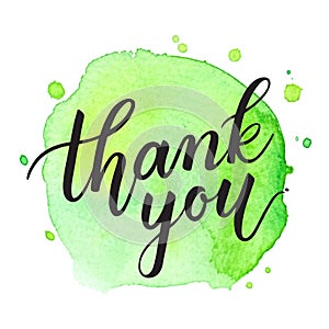 Thank you vector handwritten calligraphy over green watercolor circle background