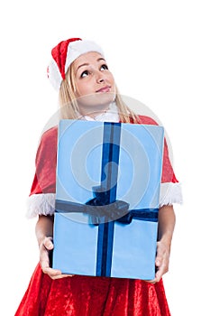 Thankful Christmas woman holding big present