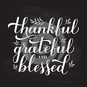 Thankful Grateful Blessed calligraphy hand lettering on chalkboard background. Thanksgiving Day inspirational quote