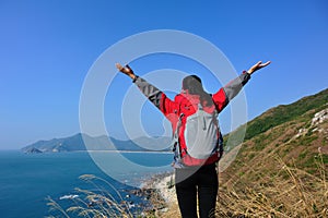 Thankful hiking woman seaside mountain