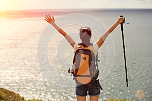 Thankful hiking woman seaside mountain