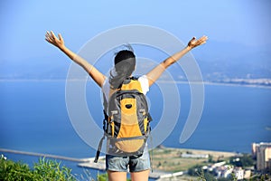 Thankful hiking woman seaside mountain