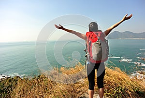 Thankful hiking woman seaside mountain