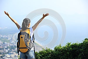 Thankful hiking woman seaside mountain