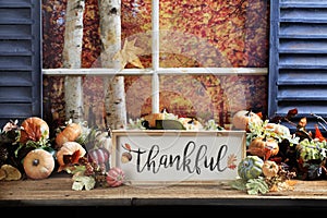 Thankful Sign on Old Wood Tabletop photo