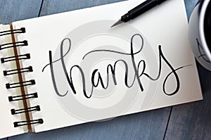 THANKS hand-lettered in notepad