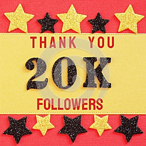 Thanks 20K, 20000 followers. message with black shiny numbers on red and gold background with black and golden shiny stars