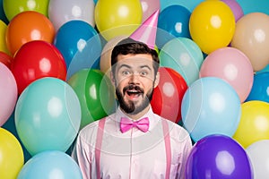 Thanks. Photo of funny guy surrounded colorful balloons surprise birthday party wear paper cone cap pink shirt bow tie