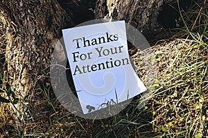 thanks for your attentions concept on white papers near trees photo
