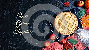 Thanksgiving apple and pumpkin pies on dark marble background.