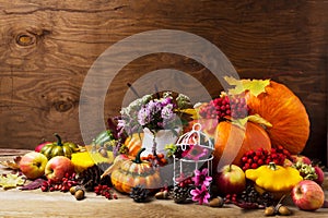 Thanksgiving arrangement with birdcage decorated cones and pink