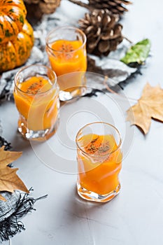 Thanksgiving autumn alcohol drink cocktail beverage with pumpkins and leaves