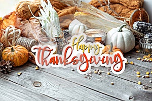 Thanksgiving Autumn background with candles, pumpkins, corn and knitted element