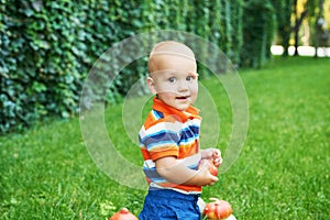 Thanksgiving baby boy. Happy kid with pumpkin. Halloween background. Bright autumn background. Colorful autumn card. Thanksgiving