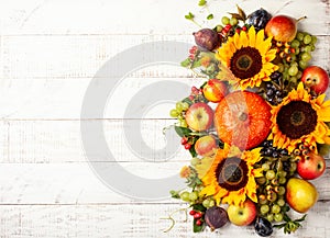 Thanksgiving background with autumn pumpkins, fruits and flowers