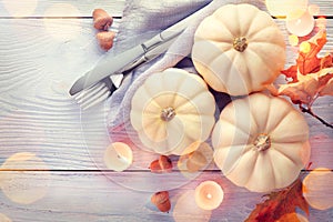 Thanksgiving background. Holiday scene. Wooden table, decorated with pumpkins, autumn leaves